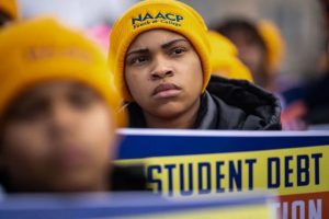 People rally in Washington, D.C., in February in support for President Biden's student debt relief plan