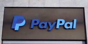 The PayPal logo is seen at an office building in Berlin, Germany, March 5, 2019. REUTERS/Fabrizio Bensch/File Photo